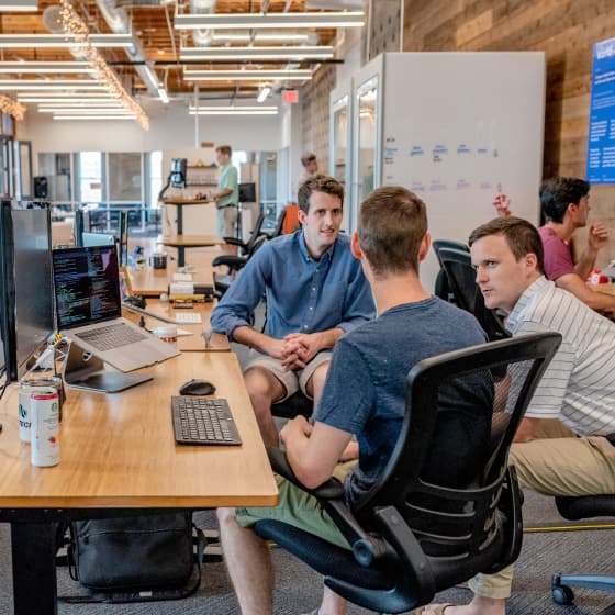 Lucidity team collaborating in modern office space